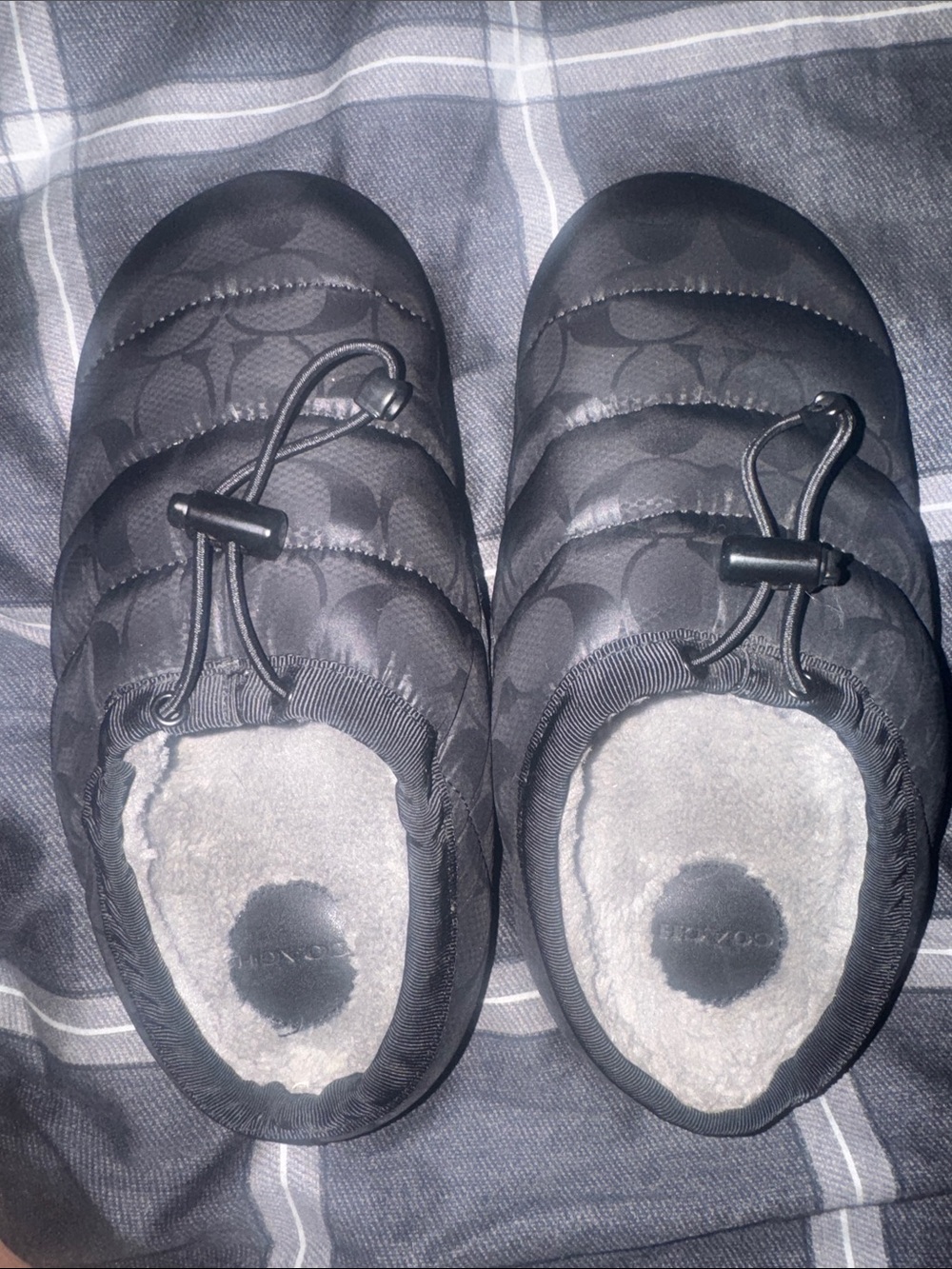 Coach Black Quilted woman’s Slip-Ons with Bungee Toggle